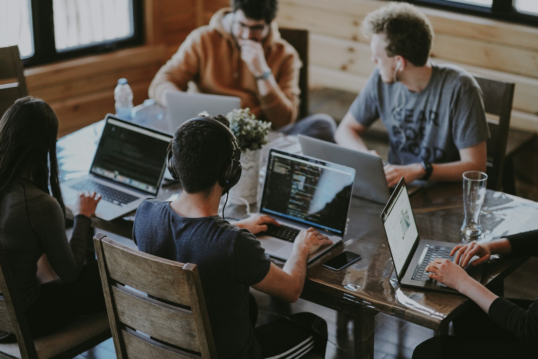 Auomni team members collaborating around a table